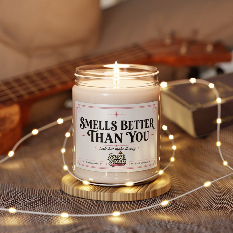 Sassy Scents soy candle burning next to fairy lights